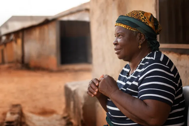 A woman speaking outdoors